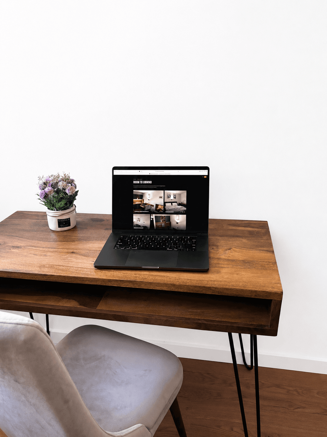 Wooden desk with a laptop and chair in the apartment